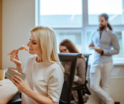 Woman eating her usual lunch at her desk