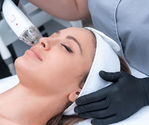 Woman relaxing while undergoing laser treatment